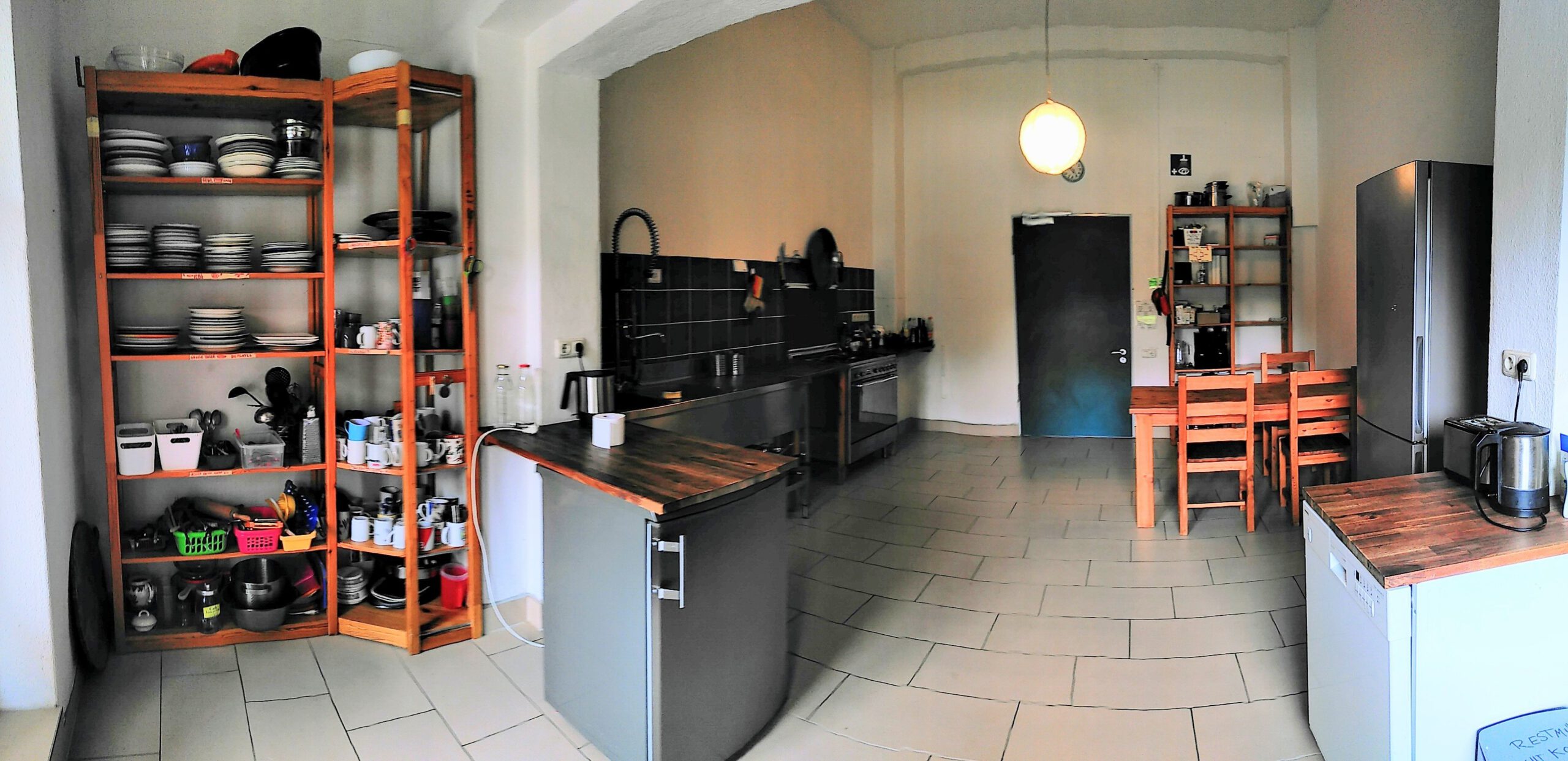 Seminarhouse kitchen with fridge and furniture
